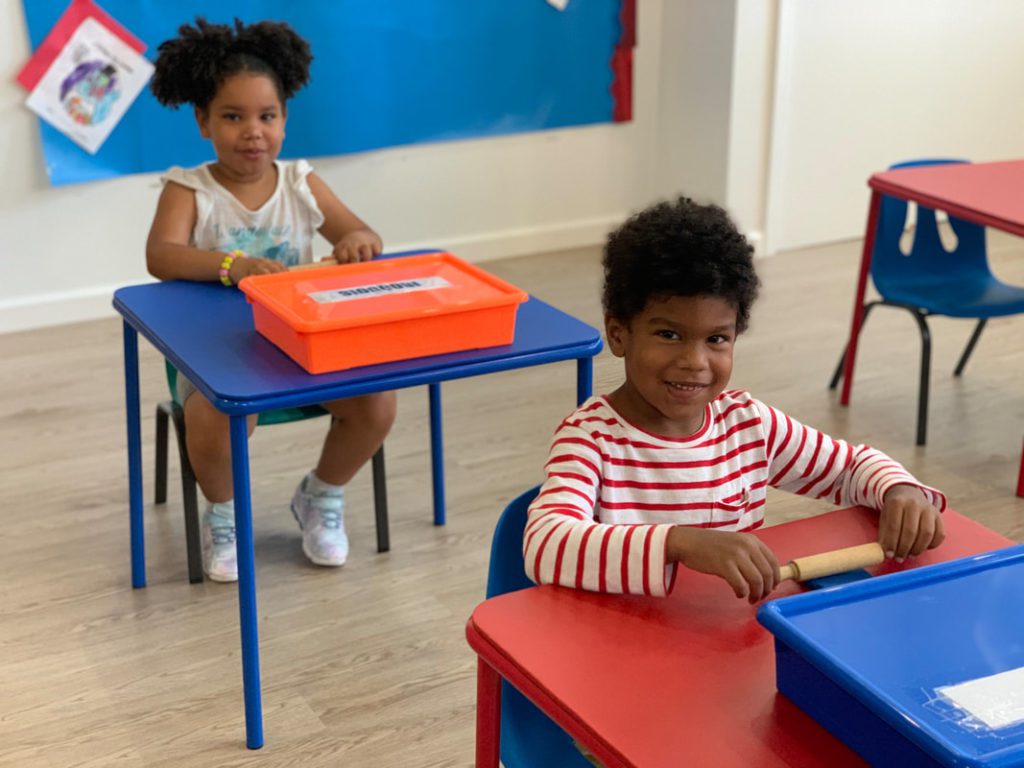 Preschool children in a classroom sitting